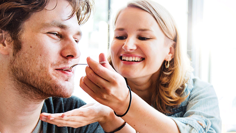 couple tasting food