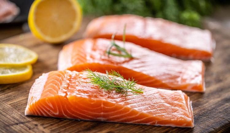 Salmon fish on a cutting board.