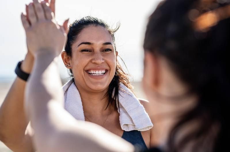 Women giving a high five after a workout