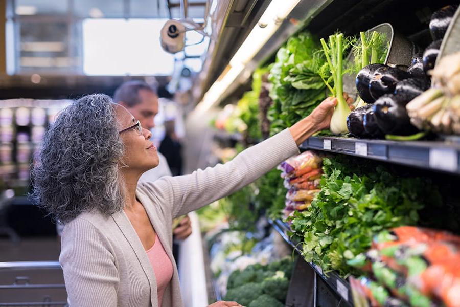 woman shopping fresh produce in store