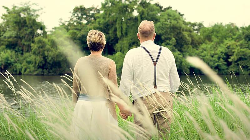 couple walking in a field