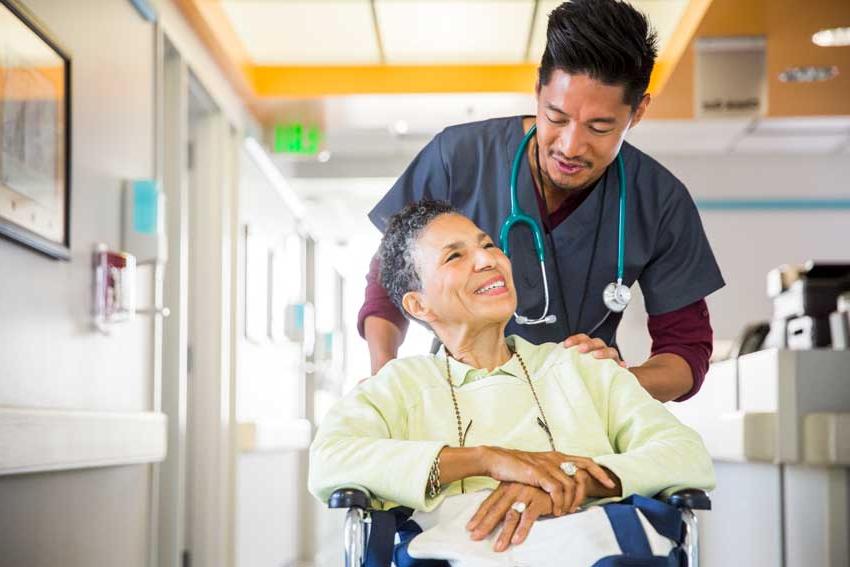 Woman in wheelchair with nurse